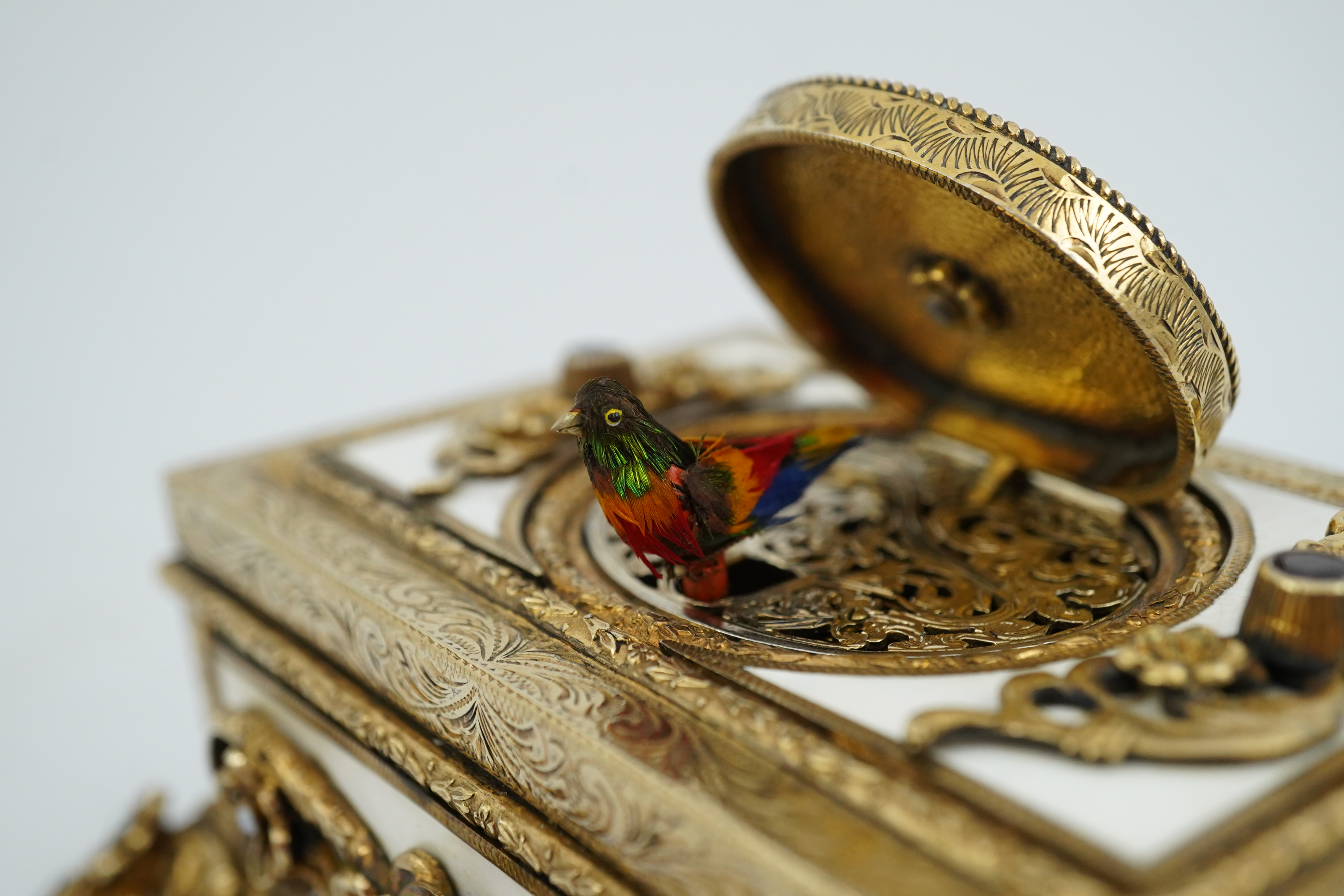 A late Karl Griesbaum Model 17 silver gilt, white enamel, garnet and cultured pearl set automaton singing bird box